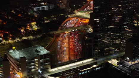 Aerial-view-of-Peachtree-Street-moving-traffic-at-night,-Atlanta,-Georgia,-USA