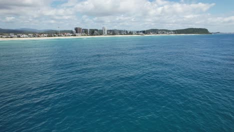 Motor-Boat-Cruising-In-The-Blue-Sea-Near-The-Palm-Beach-Coast-In-QLD,-Australia