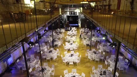 Grand-party-venue-setup-with-tables-and-lighting