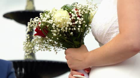 Close-up-of-a-white-and-red-rose-wedding-bouquet