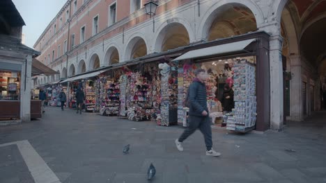 Venice-Market-Stalls-under-Arches,-Italy