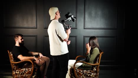 Cameraman-use-video-equipment-to-capture-indoor-studio-talk-show-conversation