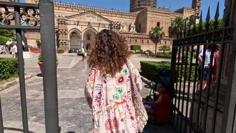 Follow-Slow-motion-shot,-women-going-to-the-Palermo-Cathedral,-Italy