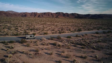 A-Mercedes-Sprinter-VAN-is-going-on-a-road-in-Joshua-Tree-National-Park-while-a-drone-is-following-it
