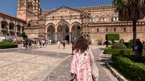 Follow-shot-of-the-women-going-to-the-Palermo-Cathedral-in-Italy