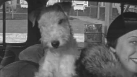 Woman-With-Her-Dog-Seated-Inside-a-Classic-Car-in-1930s-New-York-City