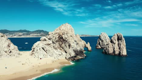 Stunning-drone-aerial-pan-around-shot-of-rock-formations-in-a-tropical-paradise