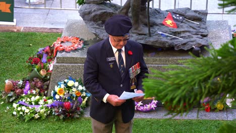 President-Phil-Ainsworth-giving-speech-to-the-veterans-and-families,-paying-homage-to-those-who-served-in-front-of-South-West-Pacific-Campaign-statue-at-Brisbane's-Anzac-Square-during-the-day