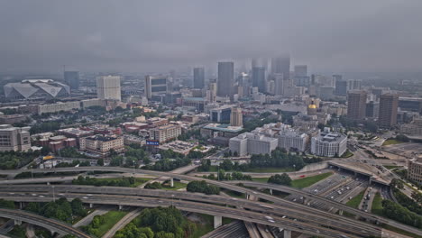 Atlanta-Georgia-Aerial-v968-hyperlapse-flyover-south-downtown-towards-Mechanicsville-capturing-urban-cityscape,-busy-freeway-traffic-and-fog-covering-the-sky---Shot-with-Mavic-3-Pro-Cine---August-2023