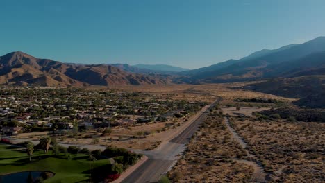 Outskirts-of-small-desert-town-golf-course-and-palm-springs-neighborhood