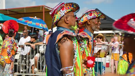 Old-black-man-with-dyed-yellow-beard-dances-in-Carnaval-parade