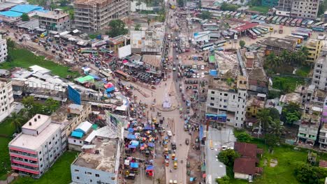 Aerial-View-Of-Bustling-Streets-Near-Rupatoly-Bus-Terminal-In-Barisal,-Bangladesh