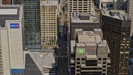 Calgary-AB-Canada-Aerial-v39-zoom-drone-flyover-downtown-commercial-area-along-7-Ave-SW-capturing-light-right-street,-office-buildings-and-municipal-city-hall---Shot-with-Mavic-3-Pro-Cine---July-2023