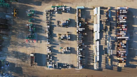 Overhead-drone-aerial-footage-of-industrial,-commercial,-yard