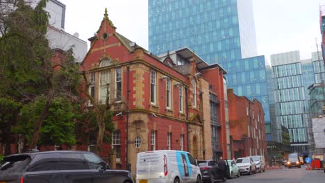 Tilt-down-shot-of-old-and-modern-architecture-of-buildings-of-Manchester,-England