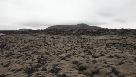Reykjanes-Peninsula-lava-fields-with-mountain-in-background,-Iceland
