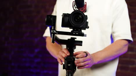 Person-balance-electronic-gimbal-stabilizer-with-digital-camera-payload