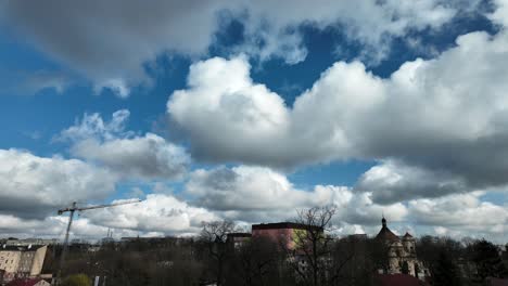 Sky-and-the-moving-clouds-timelaps-over-the-city,-blue-haven,-city-landscape-in-background