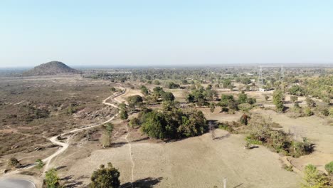 Aerial-shot-of-wide-area-of-barren-land-in-village-of-Charu-near-Chatra,-Jharkhand