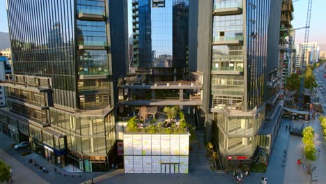 Aerial-establishing-shot-of-MUT-urban-market-at-Santiago-de-chile-modern-building-downtown-architecture,-business-center-of-South-America