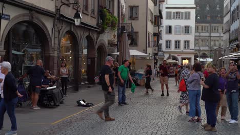 Blind-Person-Sings-in-Front-of-Strasbourg-Cathedral