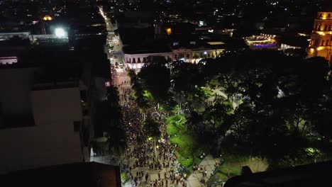 Night-aerial-orbits-urban-square-protestors-on-Bolivia's-Women's-Day