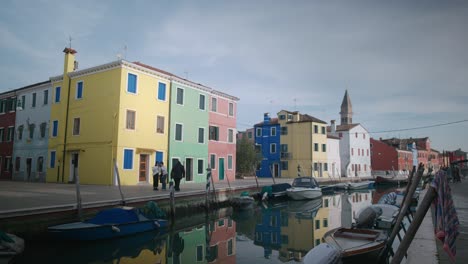 Reflective-Canals-by-Burano's-Colorful-Houses,-Venice-Italy