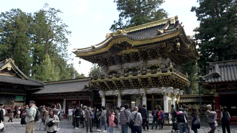 A-slow-motion-scene-captures-visitors-in-awe-before-Nikko's-iconic-Yomeimon-Gate,-in-Japan