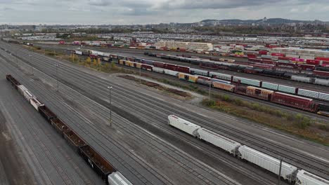 Railyard,-freight-yard-and-freight-trains---aerial-view-moving-forward
