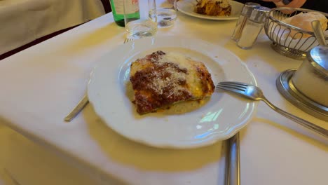 Served-Lasagna-with-Bolognese-Ragù-Dish-On-Table---High-Angle,-Close-Up