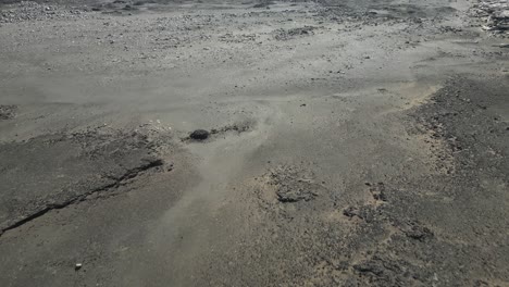 Rough-terrain-of-barren-lava-fields-in-Iceland,-aerial-downwards-view