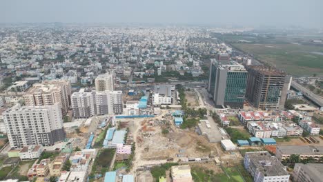 Aerial-photograph-of-Chennai,-displaying-a-significant-portion-of-the-city-still-under-development