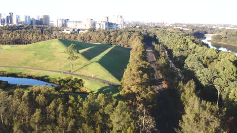 Aerial-drone-shot-over-a-quiet-highway-near-Sydney-Olympic-Park,-Australia