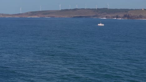 Distant-View-Of-Wind-Farm-Of-Muxia-Across-The-Ocean-In-A-Coruna,-Spain