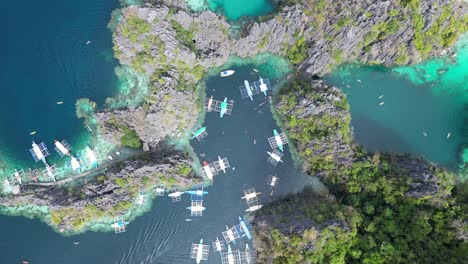 Island-Hopping-Tourism-at-Twin-Lagoon-Coron-Philippines,-Aerial-Top-Down