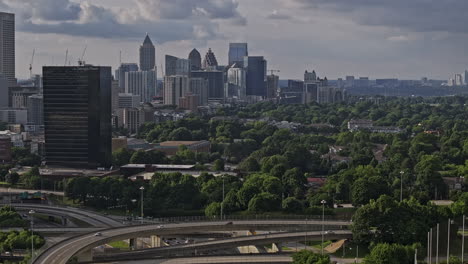 Atlanta-Georgia-Aerial-v925-zoomed-shot-drone-flyover-freeway-capturing-busy-interstate-traffics-and-cityscape-across-O4W,-Buckhead,-Midtown-and-Downtown-areas---Shot-with-Mavic-3-Pro-Cine---May-2023