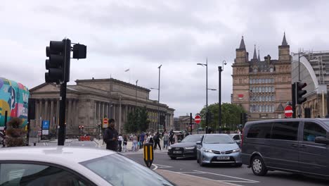 Downtown-Liverpool-England-UK-Street-Traffic,-St-George-Hall-and-Lime-Street-Train-Station,-Slow-Motion