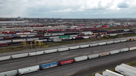 Railyard,-freight-yard-and-freight-trains---aerial-view-rotating-left