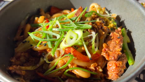 Delicious-spicy-beef-udon-noodles-with-vegetables,-fried-noodles,-Asian-cuisine,-4K-shot