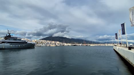 Yachts-and-Boats-Anchored-in-Puerto-Banus-Port,-Marbella-Region,-Spain