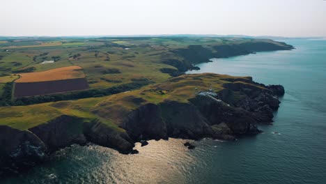 Aerial-Canvas:-Scotland’s-Rugged-Shore-of-St-Abbs-Head-Cliffs,-Views-of-Scotland-and-Europe-Destinations