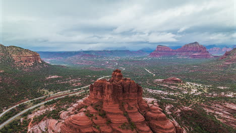 Bell-Rock-drone-hyperlapse-during-cloudy-sunset-in-Sedona,-Arizona