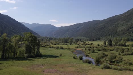 4k-Aerial-Drone-Footage-of-Field-and-Rocky-Mountains-near-Aspen-Colorado-Summer