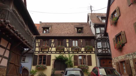 People-can-admire-many-Alsatian-half-timbered-houses-with-bright-colors-whose-windowsills-are-richly-decorated-with-flowers