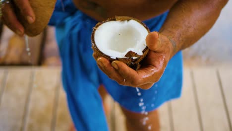 A-strong-man-skillfully-cracked-open-a-coconut-with-just-one-hit