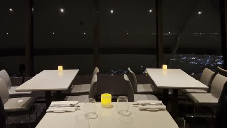 Indoor-view-of-rotating-restaurant-of-famous-and-iconic-CN-Tower-in-Toronto-at-night,-Canada