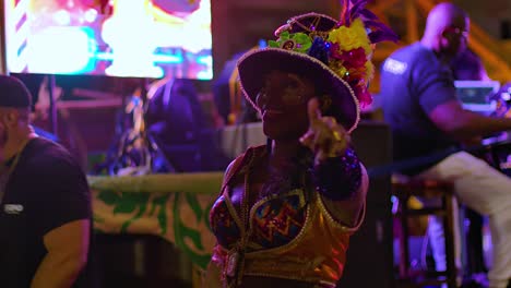 Closeup-of-beautiful-Caribbean-woman-dancing-in-Carnival-parade-at-night