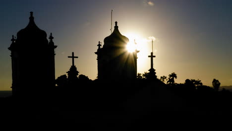 Aerial-view-of-the-the-silhouette,-Nosso-Senhor-do-Bonfim-church,-illuminated-at-sunset,-Salvador,-Bahia,-Brazil