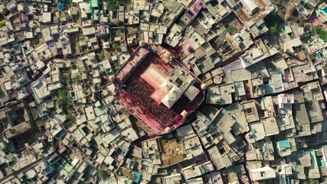 Aerial-drone-view-top-angle-shot-A-lot-of-people-are-playing-dhuleti-A-lot-of-people-are-visible,-established-shot-of-uttar-pradesh