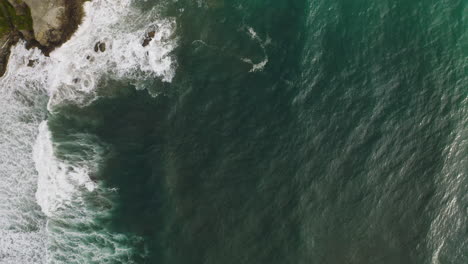 Aerial-view-of-deep-green-water-of-Pacific-Ocean-along-rocky-Oregon-coastline